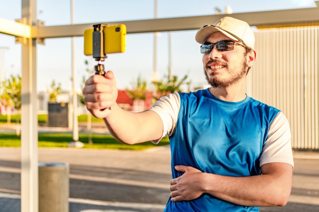 Healthy life. Athletic man in sportswear make selfie. Outdoor workout, making video call.
